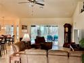 Open concept living room with access to the pool and a view of the backyard at 87 Long Meadow Ln, Rotonda West, FL 33947