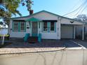 Charming waterfront cottage with teal accents at 9 Plaza E St, Bradenton, FL 34208