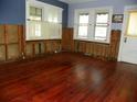 Living room with hardwood floors and exposed walls at 9 Plaza E St, Bradenton, FL 34208