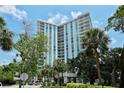 Luxury high rise building with lush landscaping at 1111 N Gulfstream Ave # 14C, Sarasota, FL 34236