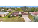 Single-story house with red tile roof, landscaping, and a large yard at 121 Van Dyck Dr # Dr, Nokomis, FL 34275