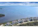 Stunning aerial view of waterfront homes and serene waters at 16 Tidy Island Blvd # 16, Bradenton, FL 34210