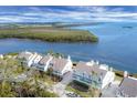 Bird's-eye view of waterfront homes with lush green landscaping at 16 Tidy Island Blvd # 16, Bradenton, FL 34210