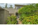 Front entrance of condo with lush landscaping at 1621 Clower Creek Dr # Tr173, Sarasota, FL 34231