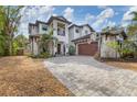 Two-story house with a driveway and basketball hoop at 1718 Prospect St, Sarasota, FL 34239