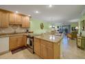 Kitchen with granite countertops and stainless steel appliances at 1801 Gulf N Dr # 175, Bradenton Beach, FL 34217