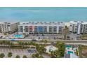 Aerial view of beachfront condo building showcasing its location at 19610 Gulf Blvd # 303, Indian Shores, FL 33785