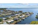 Wide shot of waterfront community with houses and canals at 210 Beeney Se Rd, Port Charlotte, FL 33952