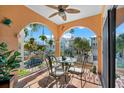 Charming balcony with outdoor seating and lovely neighborhood views at 221 Tenacity Ln, Sarasota, FL 34242