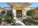 Front entry with double doors and landscaped walkway at 3298 Branch Creek Dr, Sarasota, FL 34235