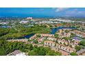 Aerial view showing condo community near a lake and other amenities at 4250 Players Pl # 2625, Sarasota, FL 34238