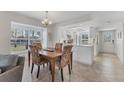 Cozy dining area with a wooden table and patterned chairs at 4402 Weybridge St # 95, Sarasota, FL 34235