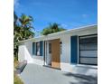 Updated home with teal accents and modern wood door at 4609 19Th W St, Bradenton, FL 34207