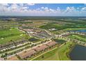 Community overview featuring a golf course, pool, and tennis courts at 5517 Palmer Cir # 101, Bradenton, FL 34211