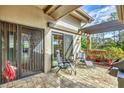 Outdoor patio with seating area and a pergola at 5625 Pipers Waite # 9, Sarasota, FL 34235