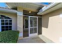 Front entrance with a decorative screen door at 601 Lakescene Dr, Venice, FL 34293