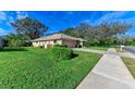 Single-story house with driveway and manicured lawn at 601 Lakescene Dr, Venice, FL 34293