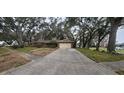 Ranch style home with a two-car garage and driveway at 616 Pawn Way, Seffner, FL 33584