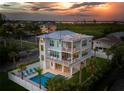 Luxury waterfront home with private pool and lush landscaping at 630 Companion Way, Longboat Key, FL 34228