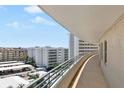 Building hallway with curved walls and ocean view at 6300 Midnight Pass Rd # 810, Sarasota, FL 34242