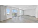 Spacious living room with mirrored wall and ocean view at 6300 Midnight Pass Rd # 810, Sarasota, FL 34242