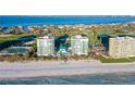 Aerial view showcasing the building's prime beachfront location and resort-style amenities at 655 Longboat Club Rd # 14A, Longboat Key, FL 34228