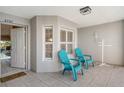 Condo entryway with tiled floor and teal chairs at 9499 Millbank Dr # 2721, Sarasota, FL 34238