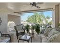 Condo lanai offers scenic golf course views and comfortable seating at 9621 Castle Point Dr # 1024, Sarasota, FL 34238