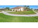 Side view of the house with a curved walkway at 1144 Hoover St, Nokomis, FL 34275