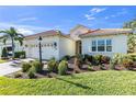 Beautiful one-story home with tile roof, landscaping, and a two-car garage at 11816 Altamonte Ct, Venice, FL 34293