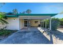 Quaint carport & screened porch at 1220 De Narvaez Ave, Bradenton, FL 34209