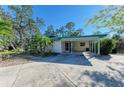 Home exterior with covered carport at 1220 De Narvaez Ave, Bradenton, FL 34209