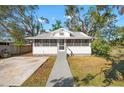 Charming house with a metal roof, screened porch and landscaped yard at 1717 32Nd St, Sarasota, FL 34234