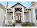 Elegant entryway with double doors and a covered porch at 1810 Wisteria St, Sarasota, FL 34239