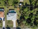 Bird's-eye view showing home, pool, and surrounding landscape at 18314 Koala Ave, Port Charlotte, FL 33948