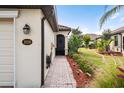 Brick walkway leading to the entrance of the home at 20289 Benissimo Dr, Venice, FL 34293