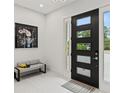 Modern entryway features a sleek black door with windows, light gray bench, and stylish artwork at 2138 Floyd St, Sarasota, FL 34239