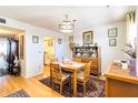 View of dining room from kitchen, featuring hardwood floors and a table for four at 255 The Esplanade N # 506, Venice, FL 34285