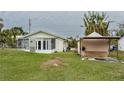 Large backyard with shed and grassy area at 29 Mound, Terra Ceia, FL 34250