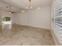 Bright dining room with tile floors and access to backyard at 4584 Country Manor Dr, Sarasota, FL 34233