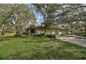 Two-story house with a two-car garage and a lush green lawn at 4655 Pine Green Trl # 24, Sarasota, FL 34241