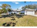 House exterior showcasing a front yard and driveway at 480 Azalea Rd, Venice, FL 34293