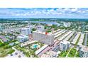 Aerial view showing condo building's location and surrounding area at 6140 Midnight Pass Rd # 902, Sarasota, FL 34242