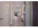 Bright and airy foyer with tile flooring and views into the living area at 6527 Clairborne Ln, Bradenton, FL 34211