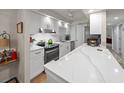 Modern kitchen featuring white cabinets and quartz counters at 6946 Woodwind Dr # 2, Sarasota, FL 34231