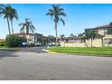 Condo building with landscaping and parking lot at 10190 Imperial Point W Dr # 16, Largo, FL 33774