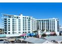 Modern highrise building with city views and unique mural art at 111 S Pineapple Ave # 708, Sarasota, FL 34236