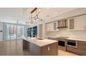 Modern kitchen with stainless steel appliances and an island at 111 S Pineapple Ave # 708, Sarasota, FL 34236