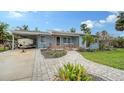 Charming home with a landscaped yard and boat parking at 141 N Adams Dr, Sarasota, FL 34236