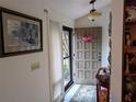 Bright entryway with a wooden table and decorative items at 1507 Water Oak Way S, Bradenton, FL 34209